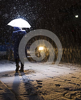 Snowbound, woman walking in the street