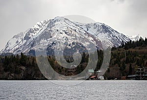 Snowcapped mountain next to Halibut Cove in the Kachemak bay near Homer Alaska USA photo