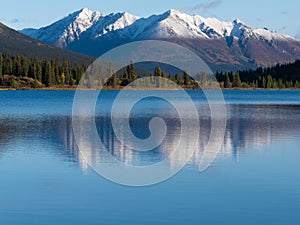 Snowcapped mountain reflection on Lapie Lake Yukon