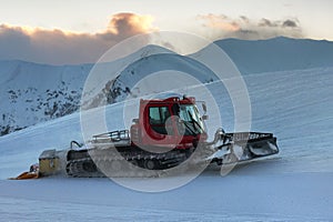 Snowcat rides to work in the evening