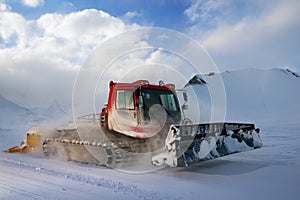 Snowcat rides to work in the evening