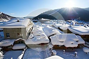 The snowcovered folk house of China`s snow town