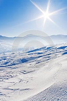 Snowcovered mountains under blue sky