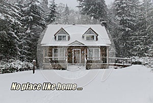 Snowcovered traditional home with No place like home positive message