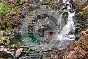 Snowdonia landscape. River flows down the mountain.