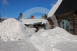 Snowdrifts outside cottage photo