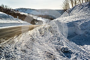 Snowdrifts and rural road