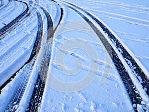 Snowdrifts on the side of the road. Bad weather and traffic. Snow on asphalt. Difficult driving conditions. Winter slosh