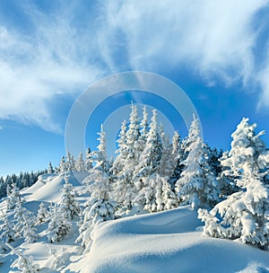 Snowdrifts on winter snow covered mountainside