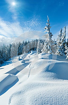 Snowdrifts on winter snow covered mountainside