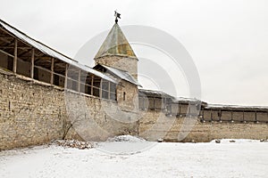 It snowed. It covers an ancient medieval fortress which stands on the banks of the river.