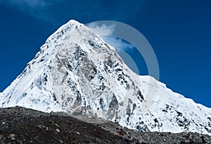 Snowed Pumori summit in Himalaya