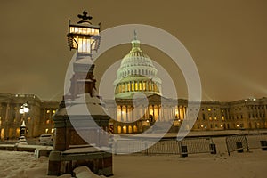 Snowfall in DC. Winter in American Capitol Washington D.C. Capitol building at night evening winter. U.S. Capitol in