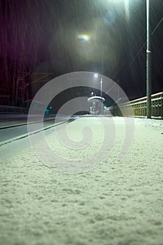 Snowfall on a deserted railway station