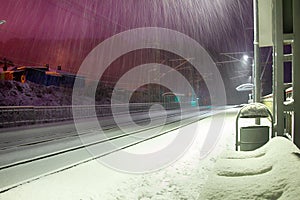 Snowfall on a deserted railway station