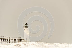 Snowfall on Manistee Light