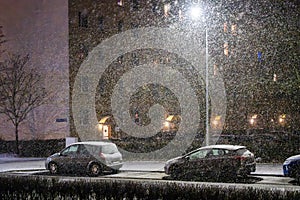 Snowfall at night in a city