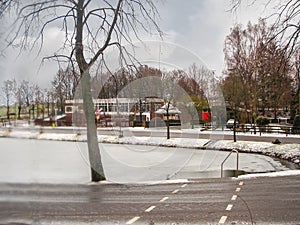 Snowfall on winter lake in the Dutch city Heerlen.