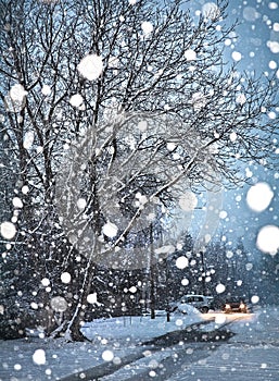 Snowfall. Winter street in heavy snowfall on evening