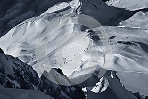 Snowfield and snow covered high alpine mountain peaks