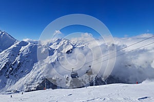 Snowfield and snow covered high alpine mountain peaks