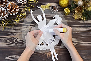 Snowflake ballerina paper. Step-by-step photo instruction. DIY concept. Children`s Christmas and New Year`s crafts. Step 12