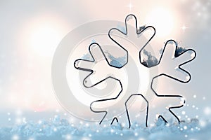 Snowflake cookie cutter in snow