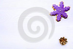 Snowflake cookie on white table, christmas background