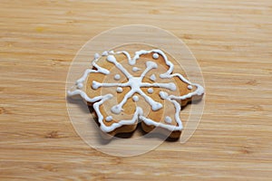 snowflake cookie on wooden background