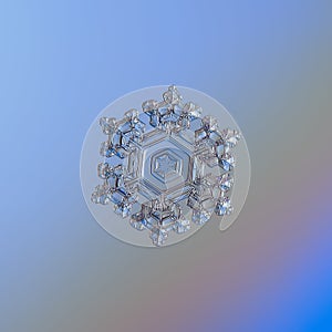 Snowflake glittering on smooth gradient background