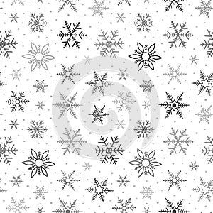 Snowflake seamless pattern. Repeating snowflakes patern. Hand draw winter design prints. Repeated black frozen snow isolated