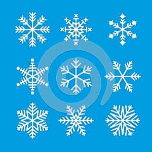 Snowflake winter set of white isolated icon silhouette on blue background. Vector illustration