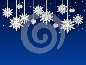 Snowflakes background. Papercut white snowflake shapes on blue backdrop, christmas winter holiday card. Xmas frozen