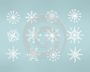 Snowflakes on blue background. Doodle snow icons