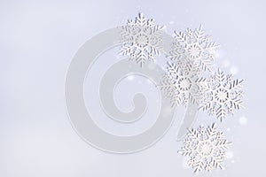 Snowflakes on Blue Background Holiday Festive Christmas Winter Concept Copy Space Top View Minimal