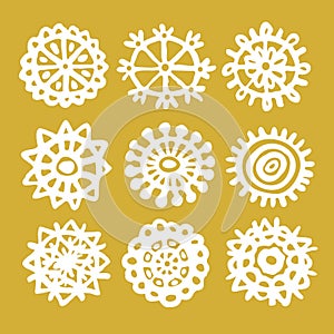 Snowflakes drawn in childish style linear icons set on golden