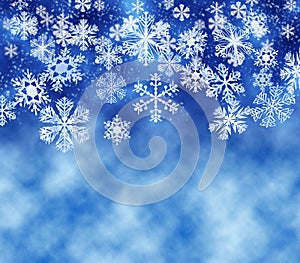 Snowflakes falling, light blue background