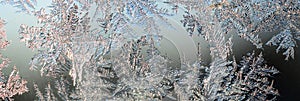 Snowflakes frost rime macro on window glass pane