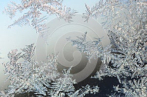 Snowflakes frost rime macro on window glass pane