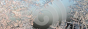 Snowflakes frost rime macro on window glass pane