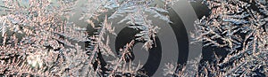 Snowflakes frost rime macro on window glass pane