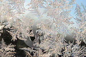 Snowflakes frost rime macro on window glass pane