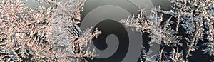 Snowflakes frost rime macro on window glass pane