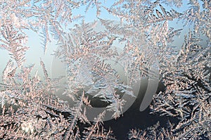 Snowflakes frost rime macro on window glass pane