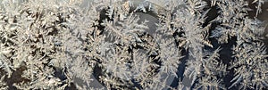 Snowflakes frost rime macro on window glass pane