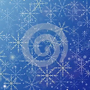 Snowflakes and glare on blue gradient - christmas background