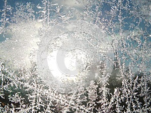 Snowflakes on glass as winter texture background