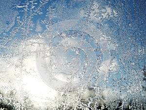 Snowflakes on glass as winter texture background