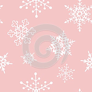 Snowflakes seamless pattern of many snowflakes on the pale pink background vector