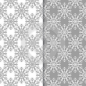 Snowflakes. Seamless patterns. Gray and white winter ornaments